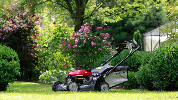 Side view of Honda HRX with large grass collector.